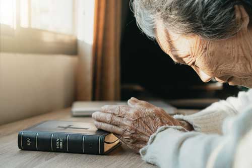 old woman praying